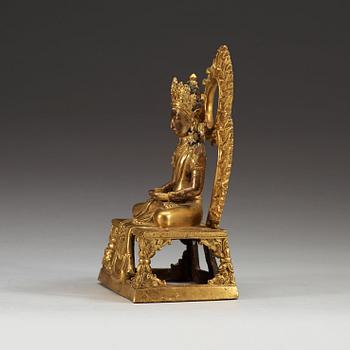 A gilt bronze figure of Bodhisattva, Qing dynasty, 18th Century. With inscription to base.
