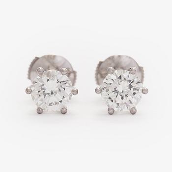 Bucherer, a pair of 18K white gold earrings with brilliant-cut diamond. SJL-certificate.