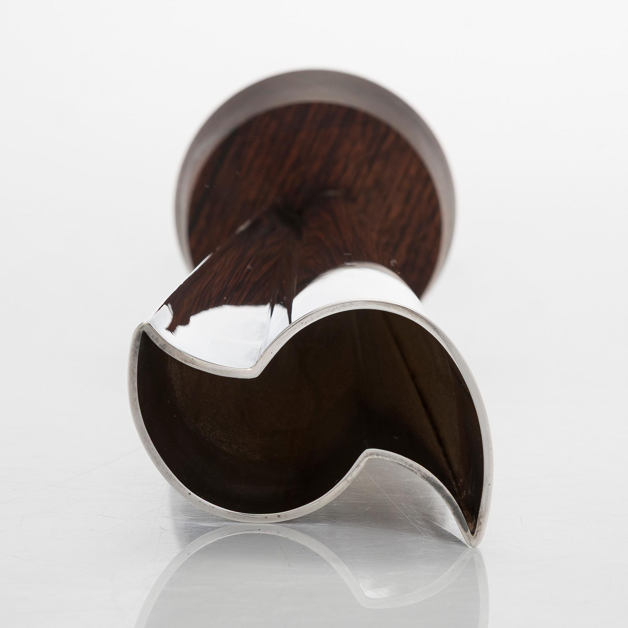 Tapio Wirkkala, a silver TW 228 'Flame' vase on a rosewood base, Kultakeskus, Hämeenlinna 1965.
