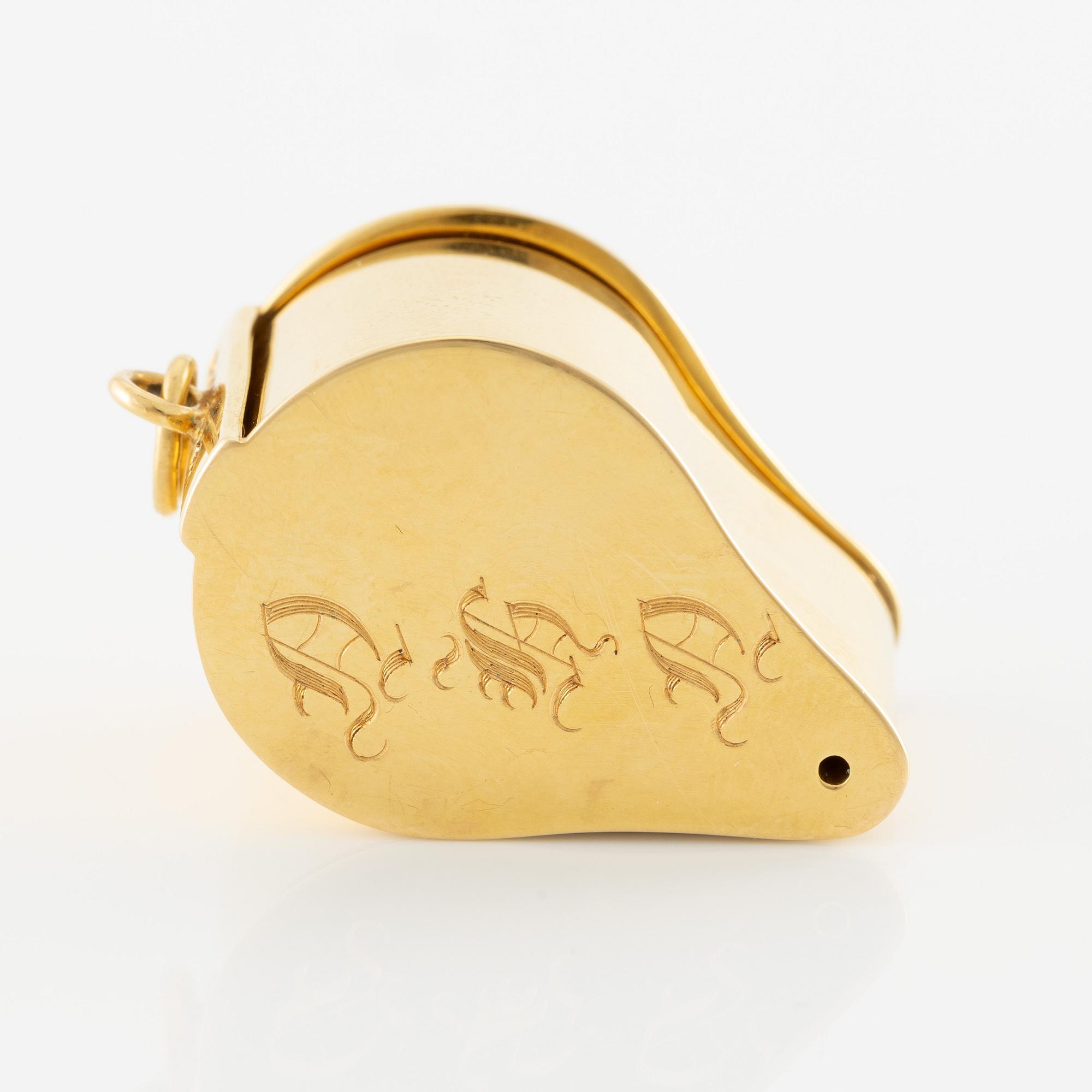 A loupe in 18K gold.