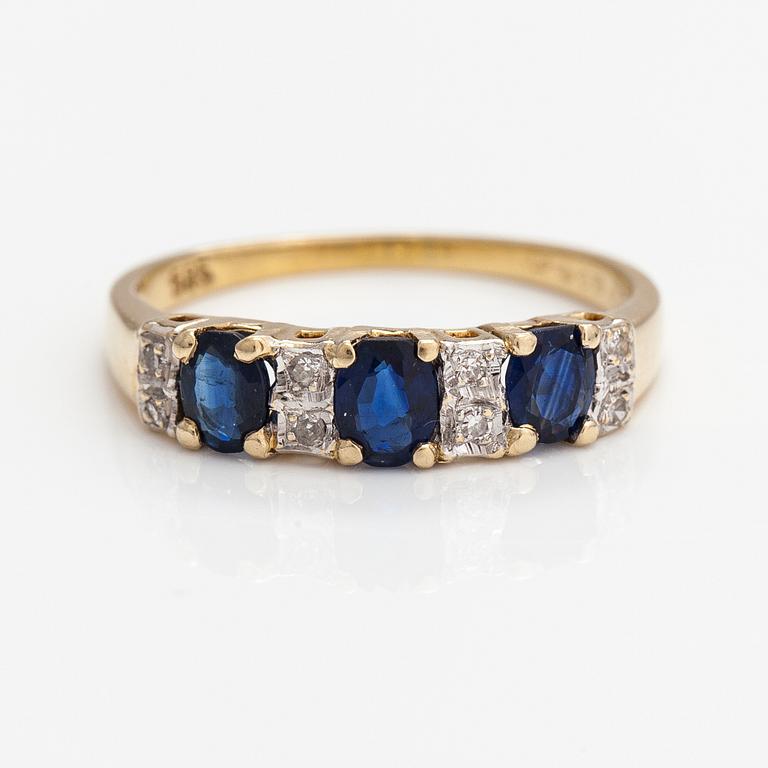 A 14K gold ring with diamonds ca. 0.05 ct and sapphires. Finnish import marks 1990.
