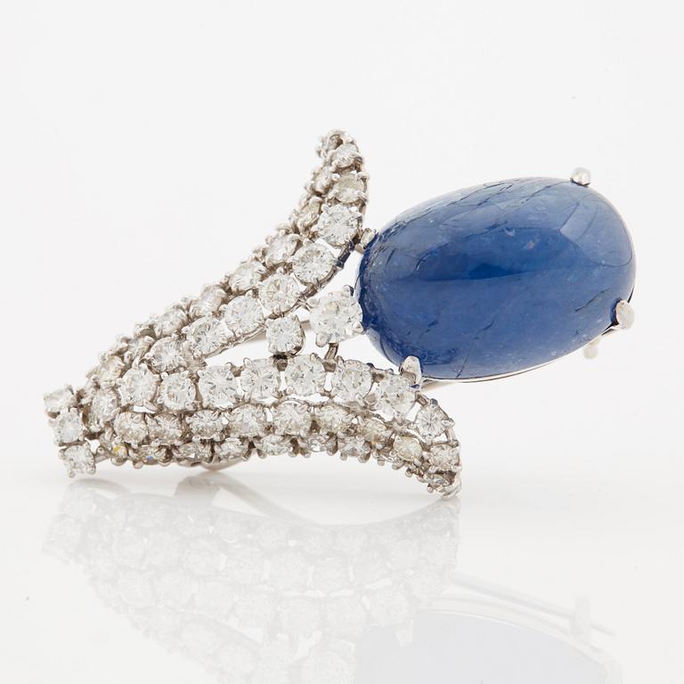 A cabochon cut Ceylon sapphire and brilliant cut diamond pendant/brooch.