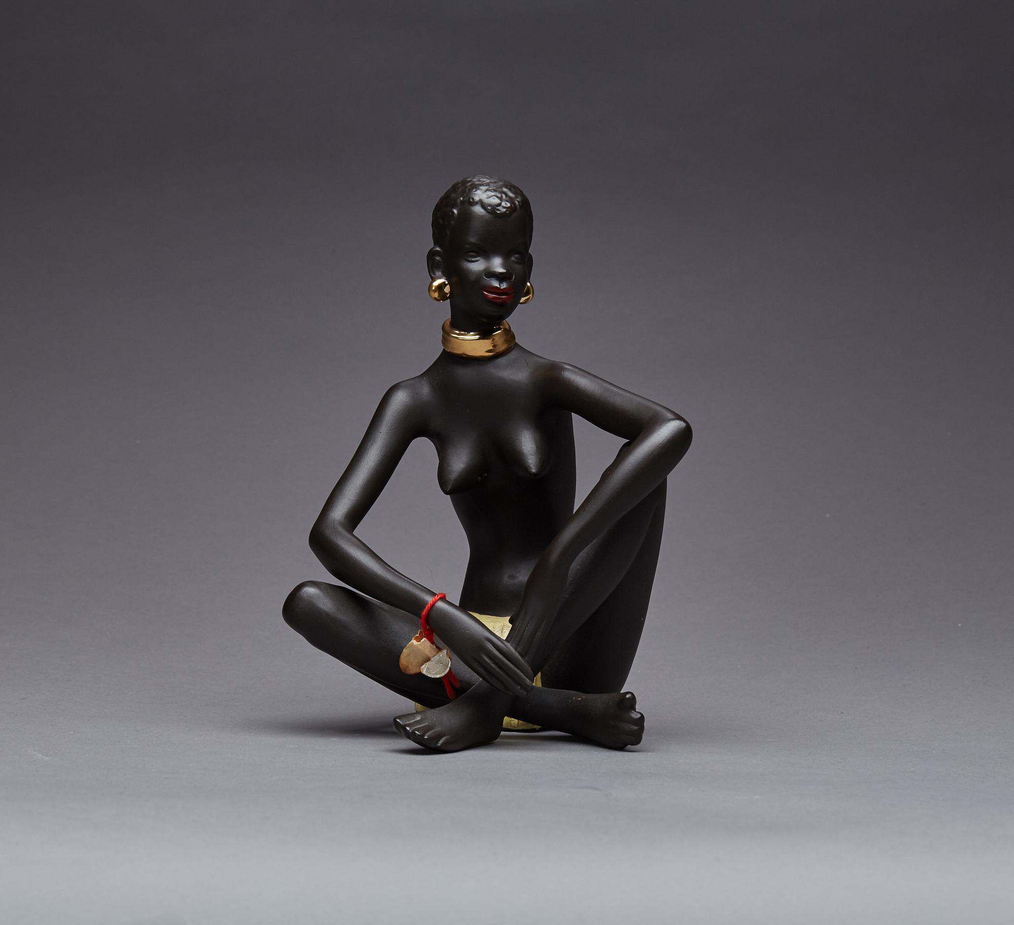 FIGURIN, etikettmärkt Goldscheider.