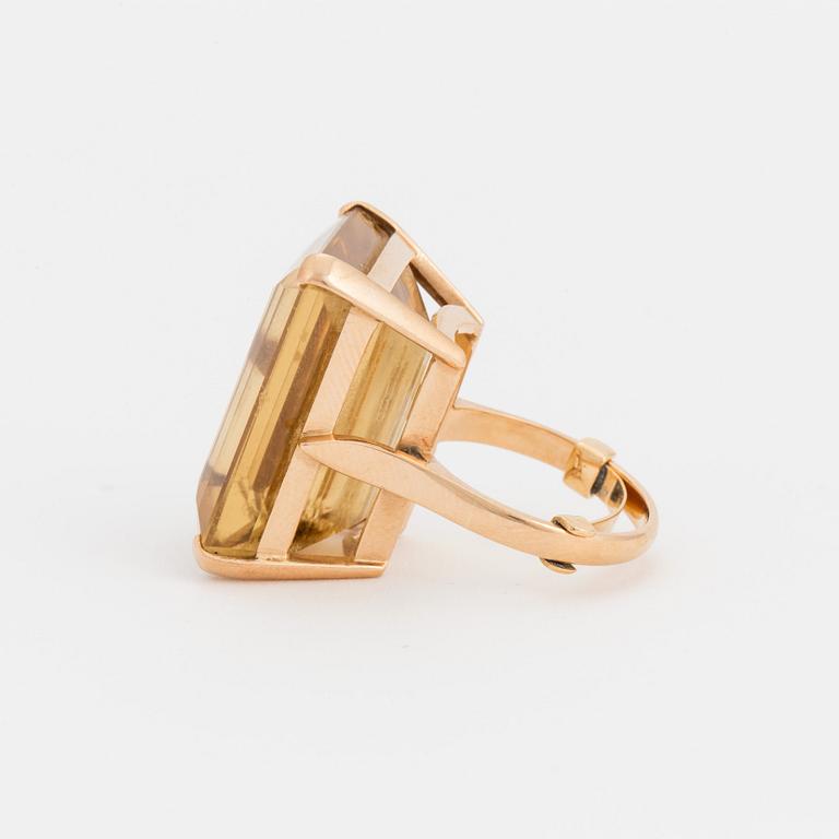 A ring set with a step-cut citrine.