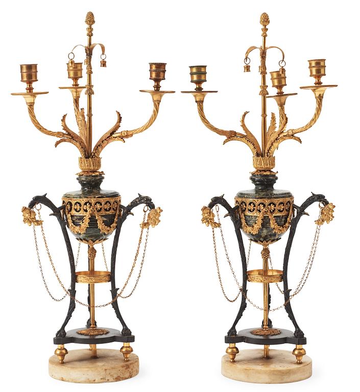 A pair of  Louis XVI-style late 19th century three-light candelabra.