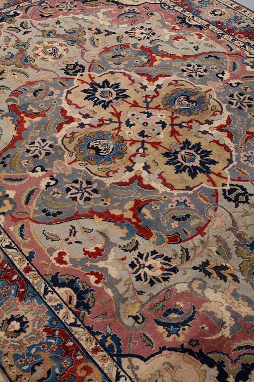 A CARPET, semi-antique, Tabriz, signed Jabarzade ca 337,5 x 242,5 cm.