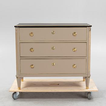 A painted Gustavian style chest of drawers from around the year 1900.
