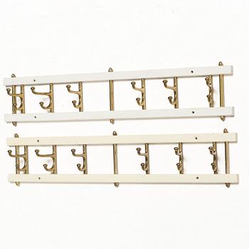 Coat hangers, a pair, “Dekorativ”, Skoglunds Metallgjuteri, Anderstorp, mid-20th century.