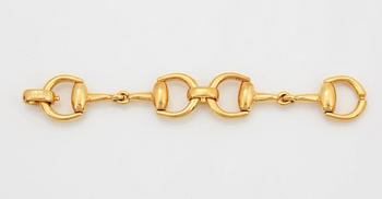 An 18K gold Gucci bracelet.