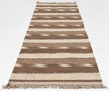 A Persian kilim runner, c. 248 x 62 cm.