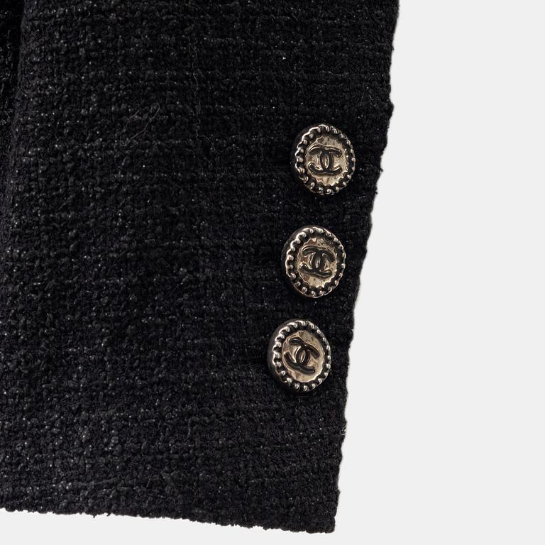 Chanel, A black bouclé jacket, size 34.