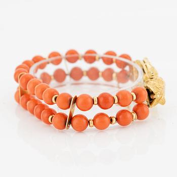 Bracelet, coral, with an 18K gold clasp in the shape of leopard heads, with diamonds.