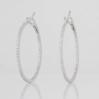 A pair of brilliant-cut diamond hoop earrings. Total carat weight circa 1.00 ct.