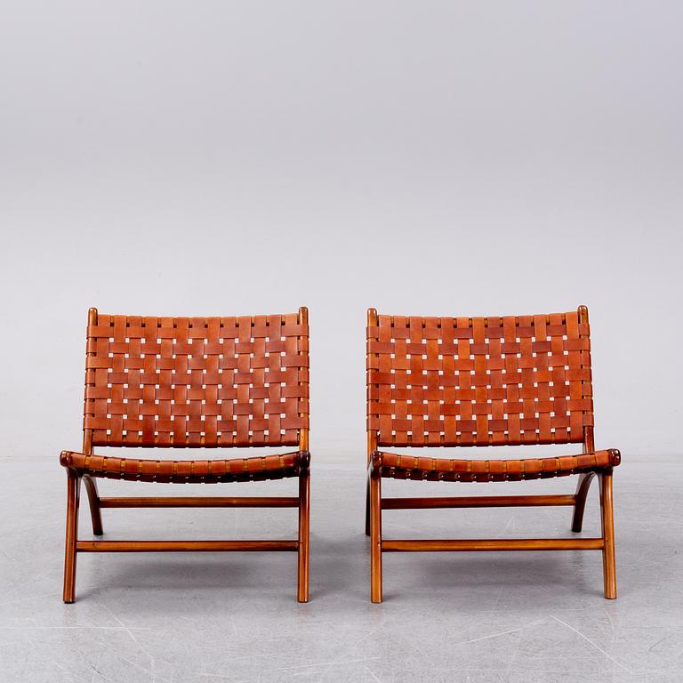 A pair of 'Porto' teak easychairs by Newport.
