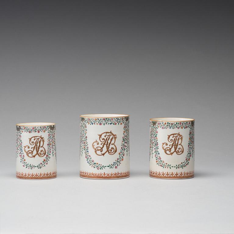 A group of three famille rose armorial jugs, Qing dynasty, Qianlong (1736-95).