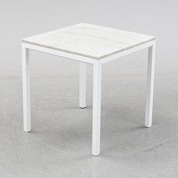 A marble top table, 21th century.