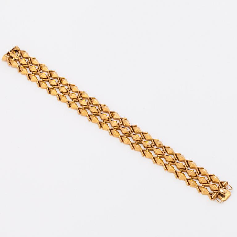 A 14K gold bracelet.