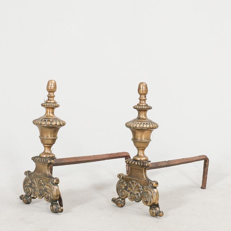 A pair of French metal chenets later part of the 19th century.