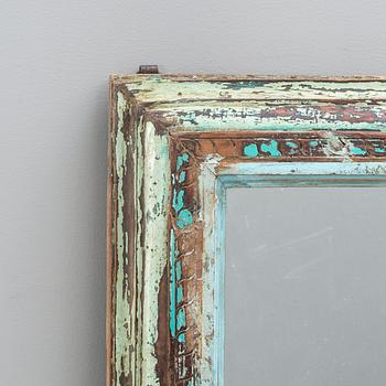 An Indian panted wood mirror 20th/21st century.