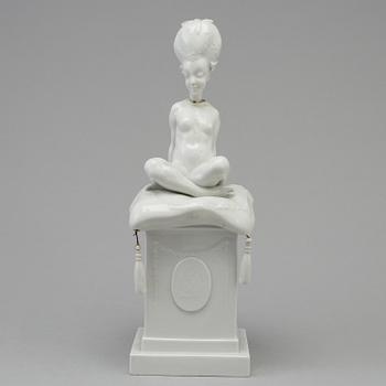 A white glazed Royal Copenhagen porcelain nodding head figure, Denmark, early 20th Century. Not first quality.