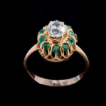 A RING, old cut diamond c. 0.70 ct and emeralds.