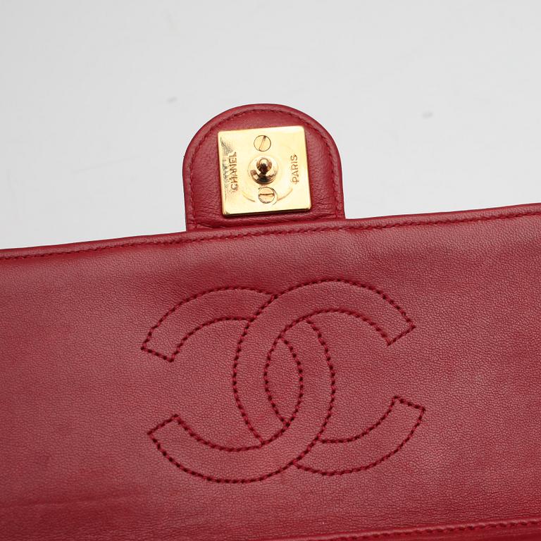 CHANEL, a red leather shoulder bag.