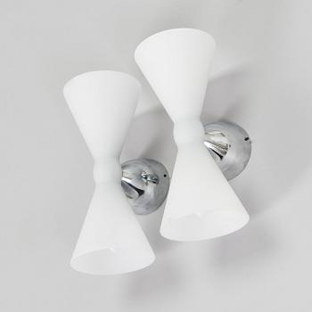 A pair of early 2000s wall lamps.