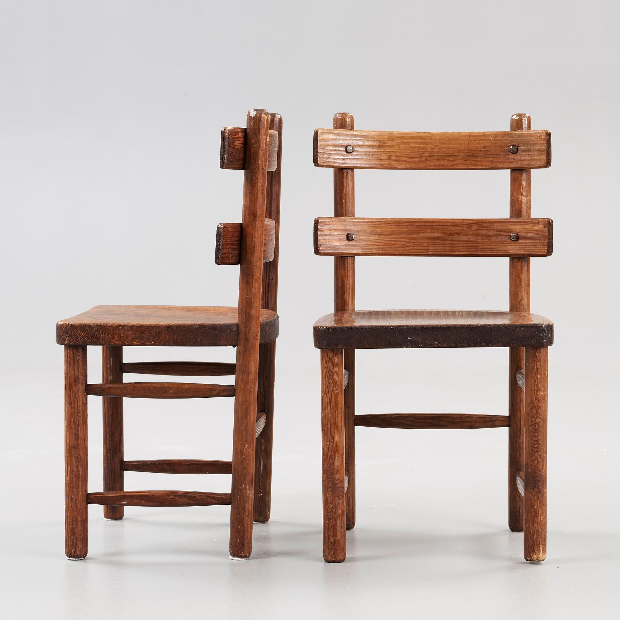A pair of Axel Einar Hjorth stained pine 'Sandhamn' chairs.