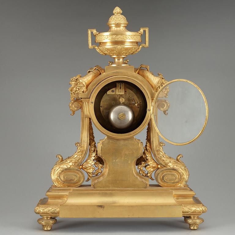 A Louis XVI-style late 19th Century gilt bronze mantel clock.