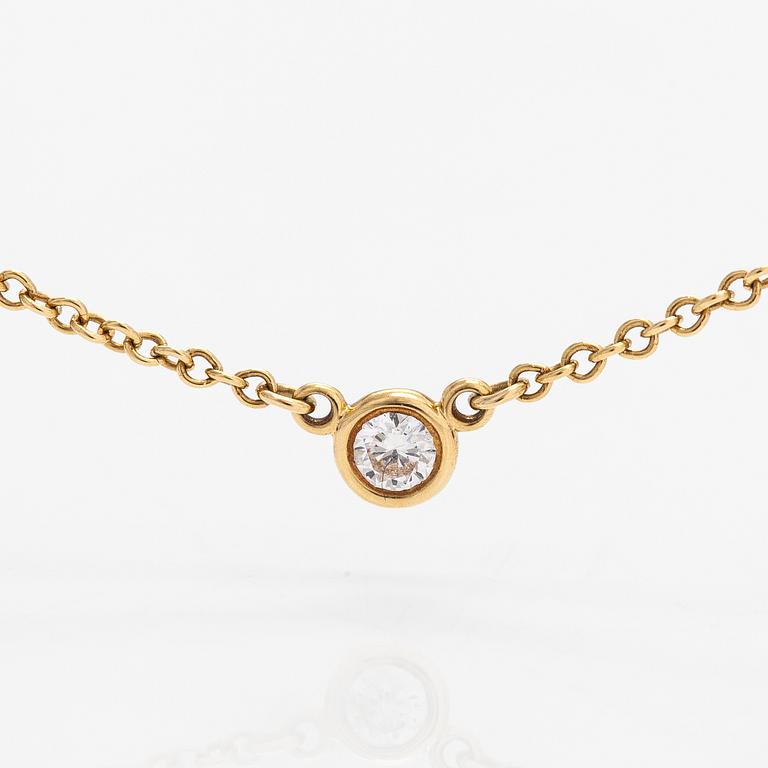 Tiffany & Co, Elsa Peretti, an 18K gold necklace with a ca. 0.05 ct  diamond. Marked Tiffany & co, Peretti.