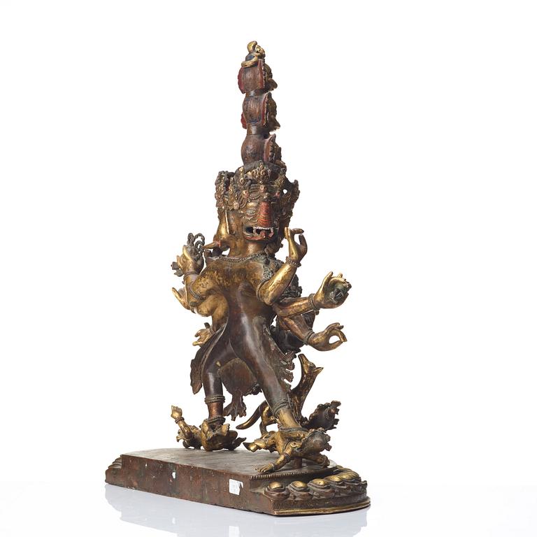 A large Tibetan eight armed deity, probably 20th Century.