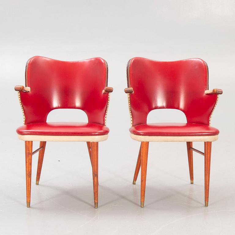 A pair of 1950s armchairs.