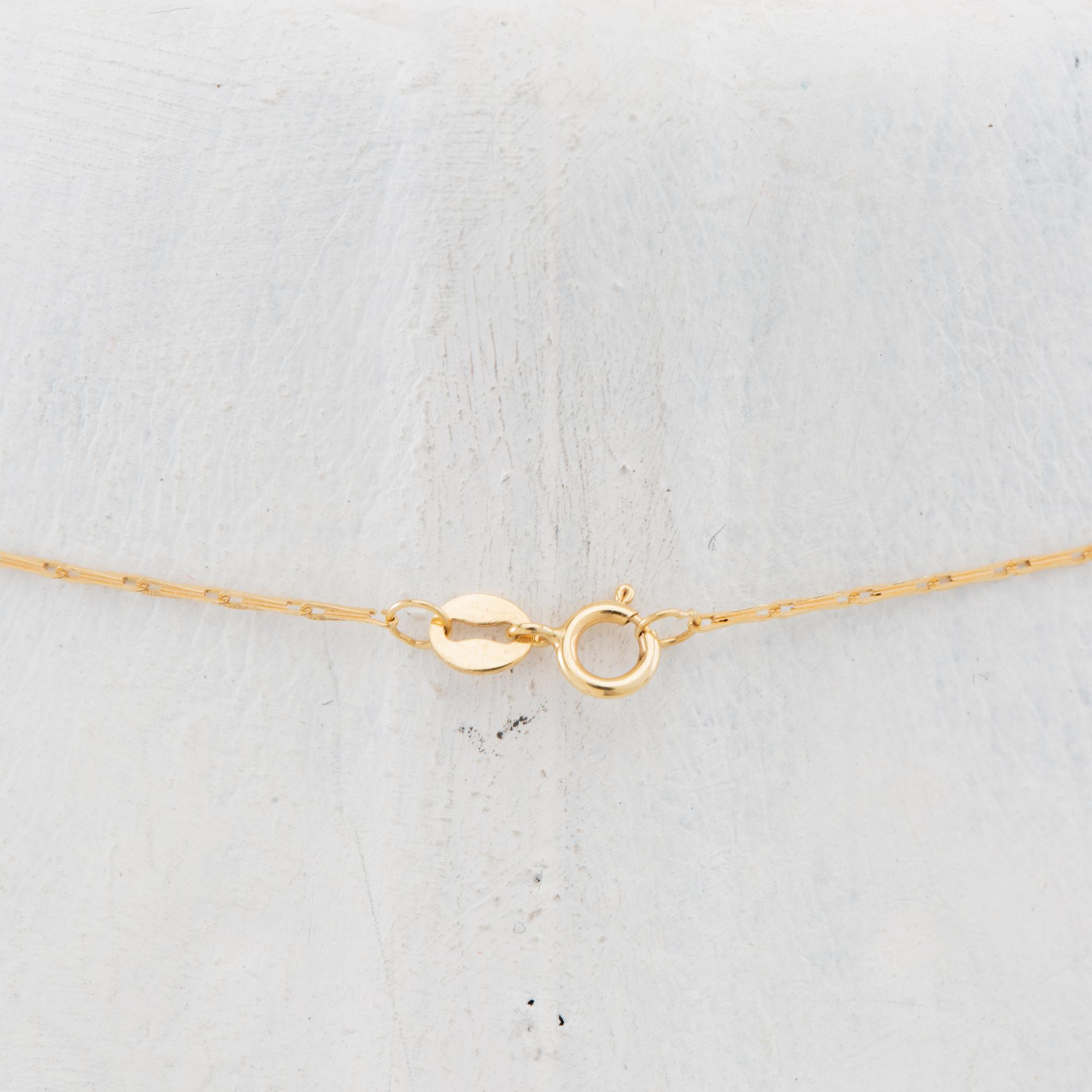 Necklace of 14K and 18K gold with a cultured pearl.