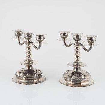 A pair of Baroque style silver candelabras, bearing the mark of CG Hallberg, Stockholm, 1928.