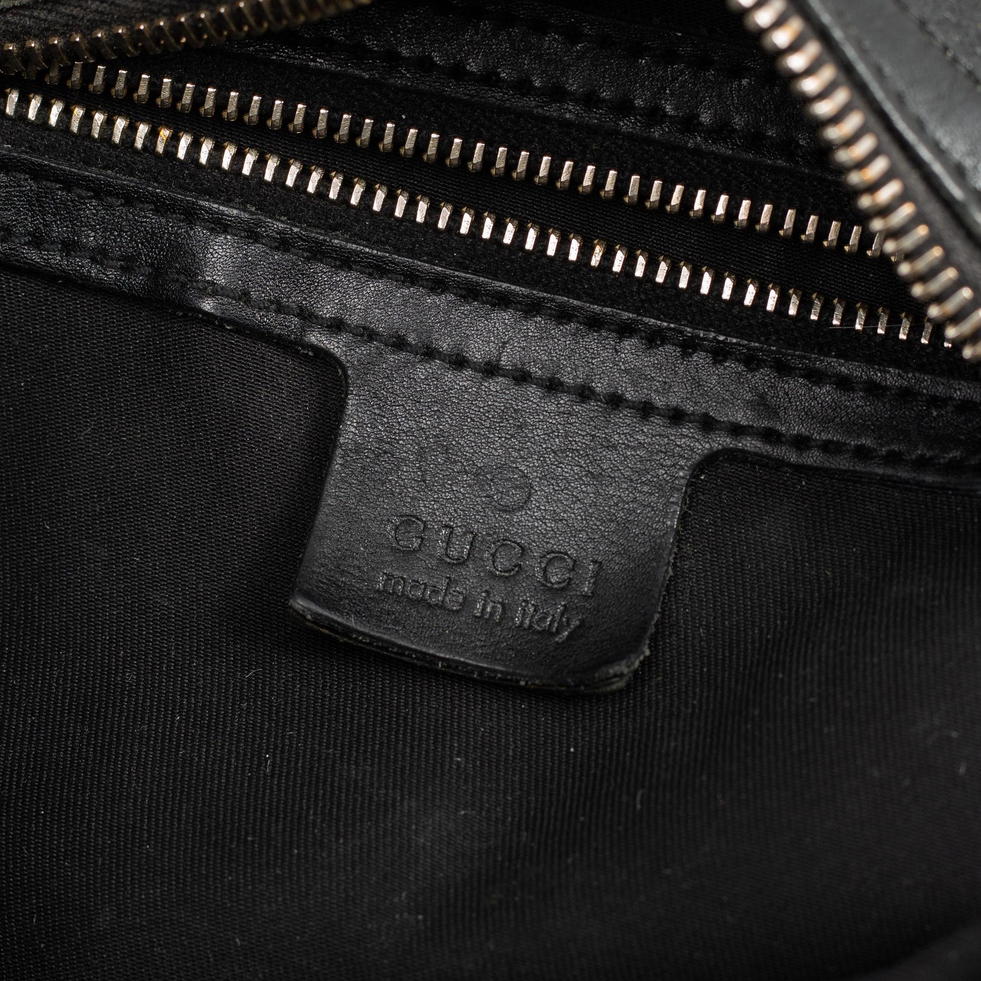 GUCCI, a leather horse-bit bag.