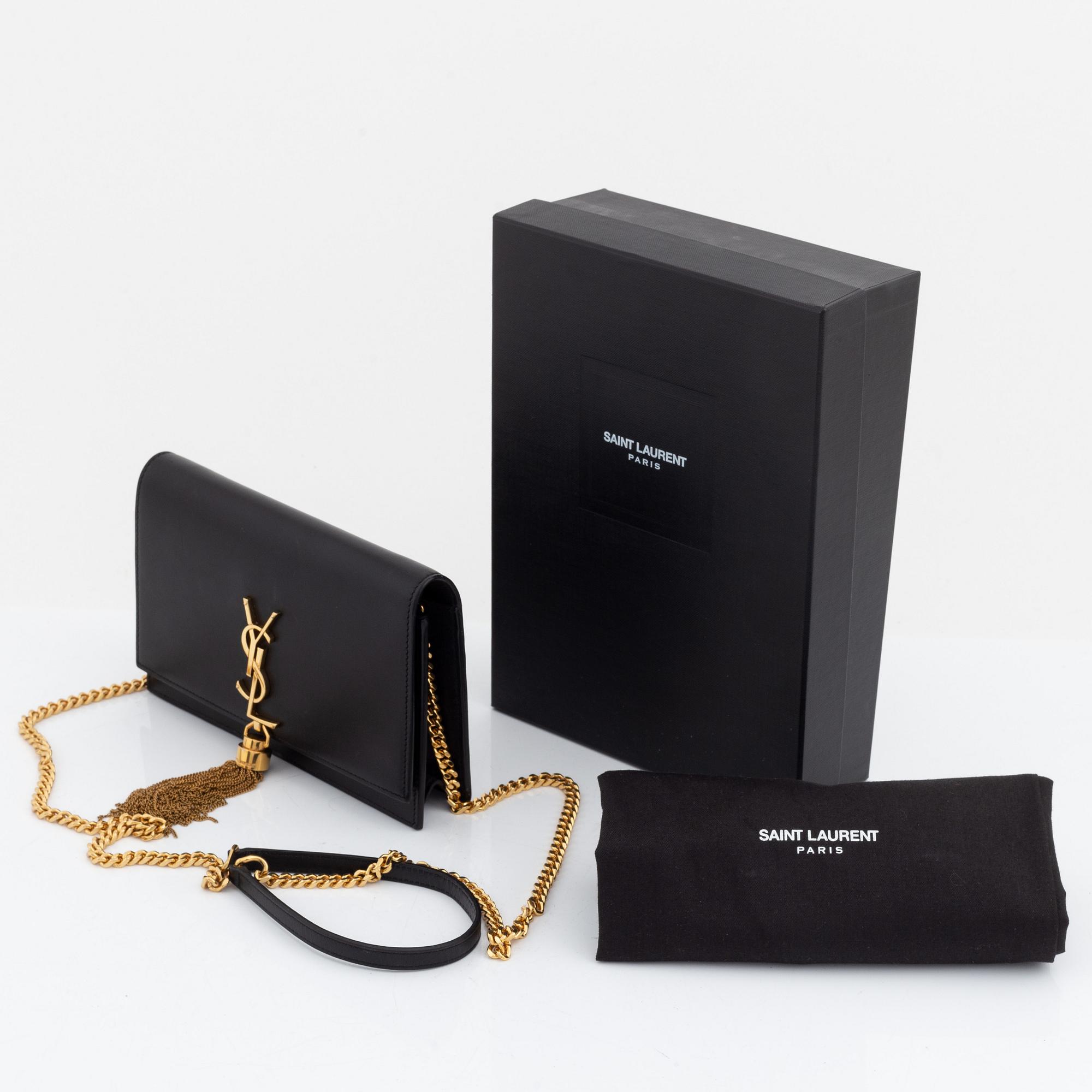 Yves Saint Laurent, a black leather 'Kate Medium' clutch,.