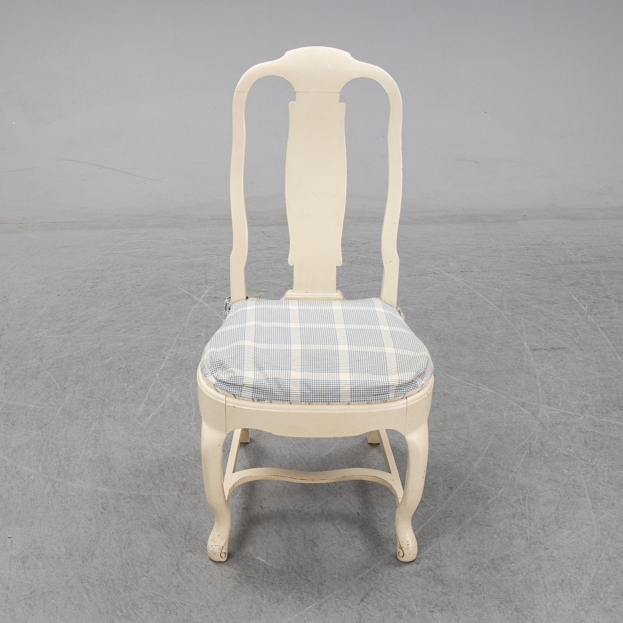 A set of six chairs and a pair of armchairs, rococo style, early 20th century.