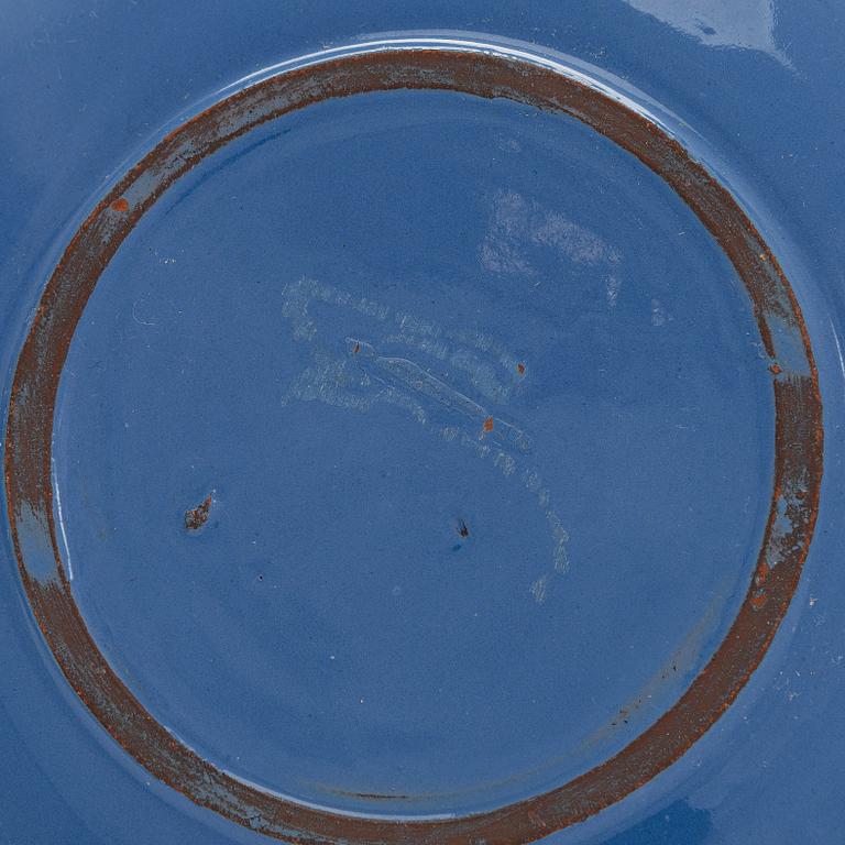 Marita Lybeck, a set of three ceramic plates and cream jug, red clay, signed ML.