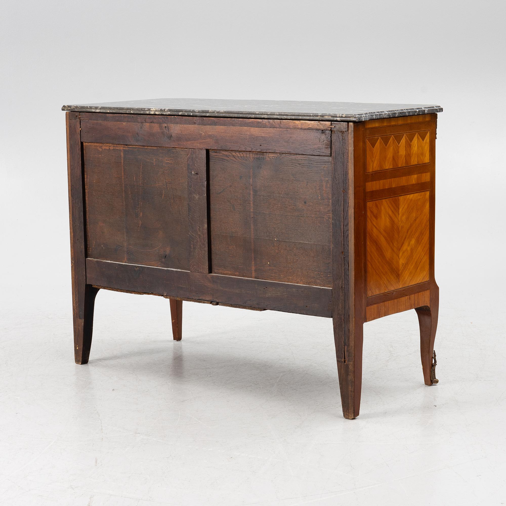 A Louis XVI style chest of drawers, France, circa 1900.