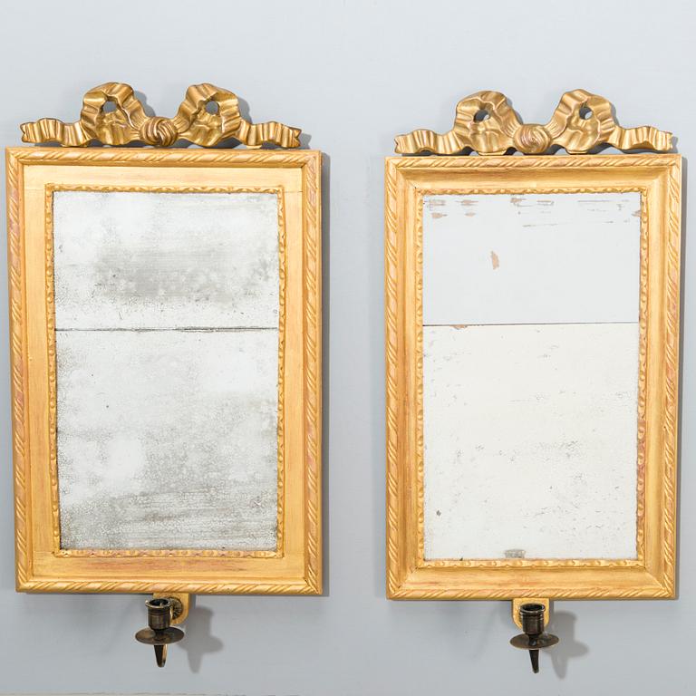A pair of mirrored wall sconces from the latter half of the 20th century.