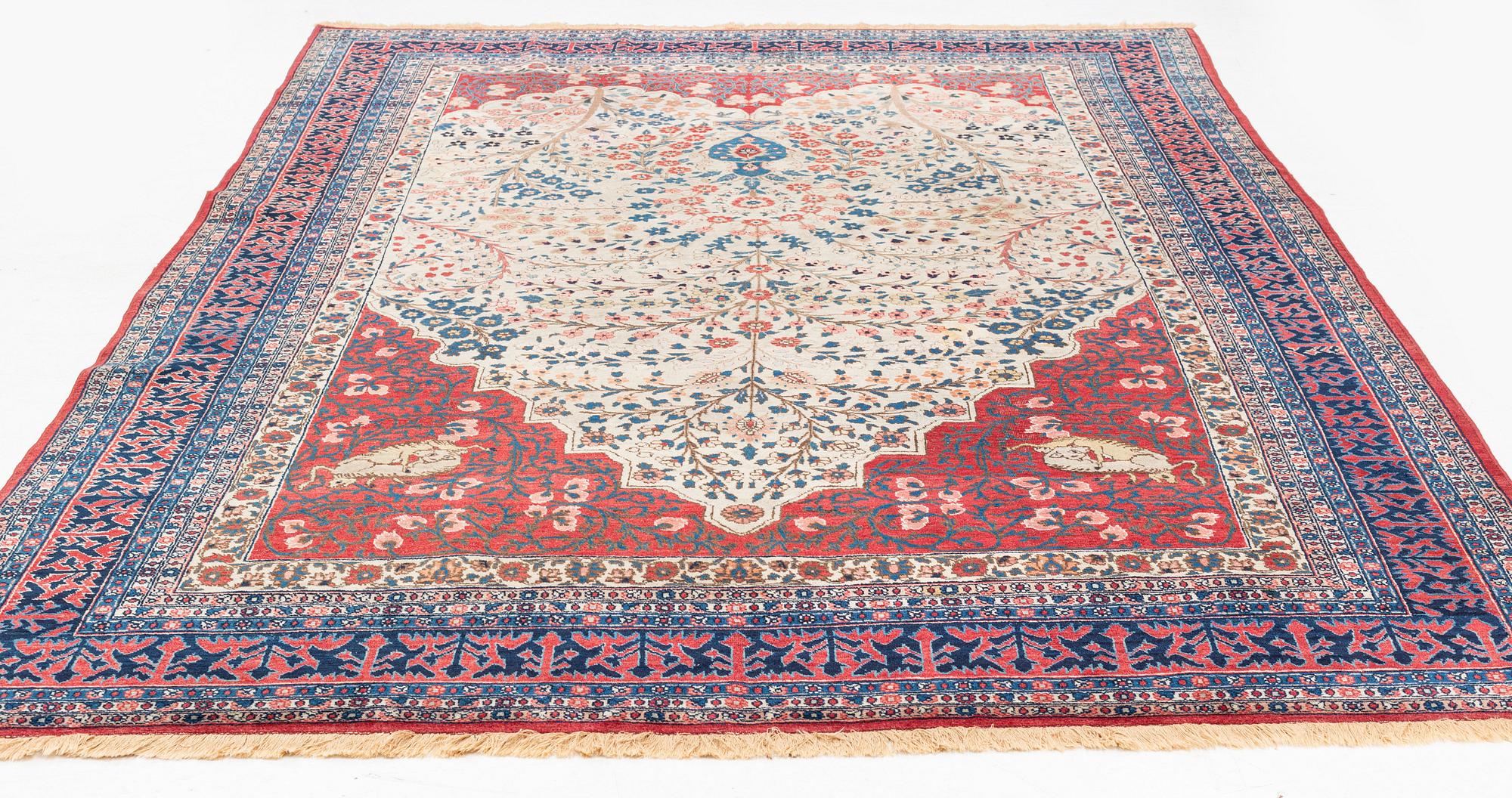 An antique Tabriz carpet, ca 333 x 223 cm.