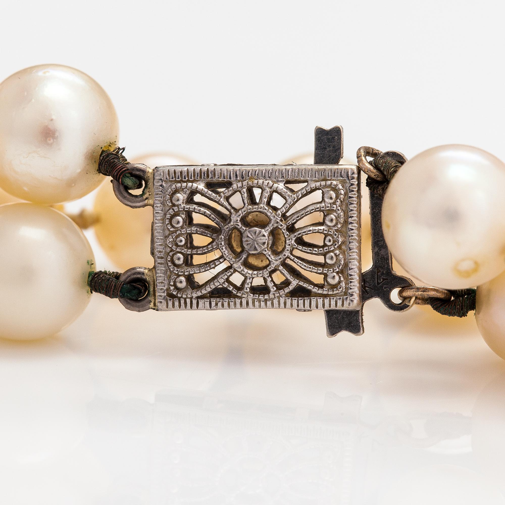 A 2-strand pearl collier with cultured pearls and a 14K white gold clasp.