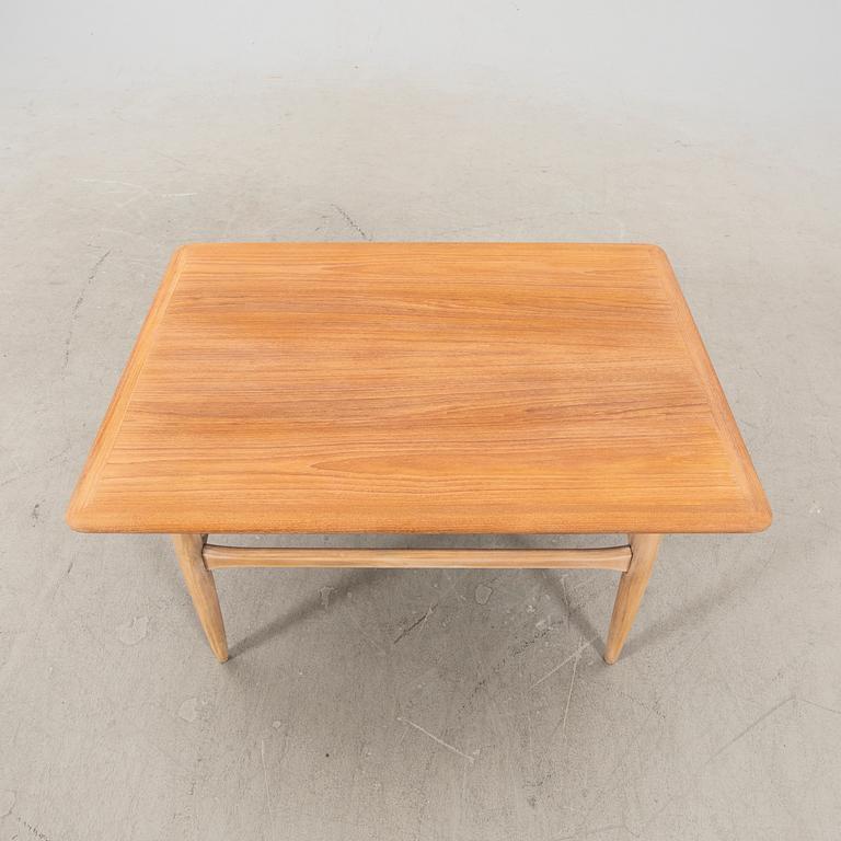 Kurt Østervig, an oak and teak coffee table alter part of the 20th century.