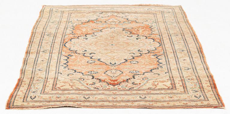 An antique Tabriz rug, ca 174 x 125 cm.