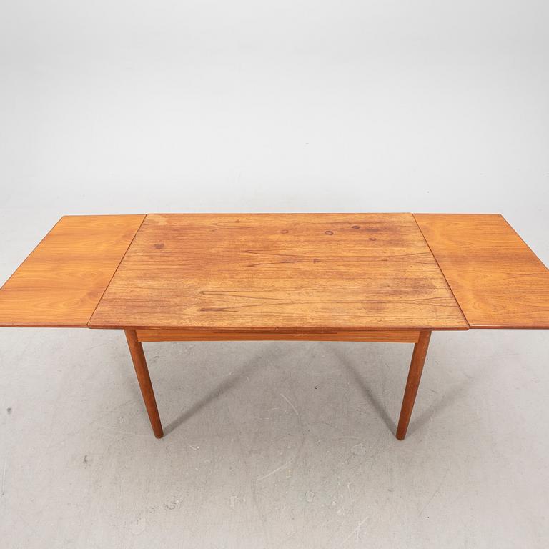 A 1960s teak dining table.