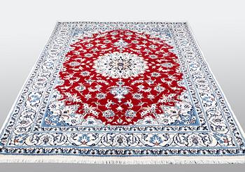 A carpet, Nain, part silk, ca 238 x 170 cm.