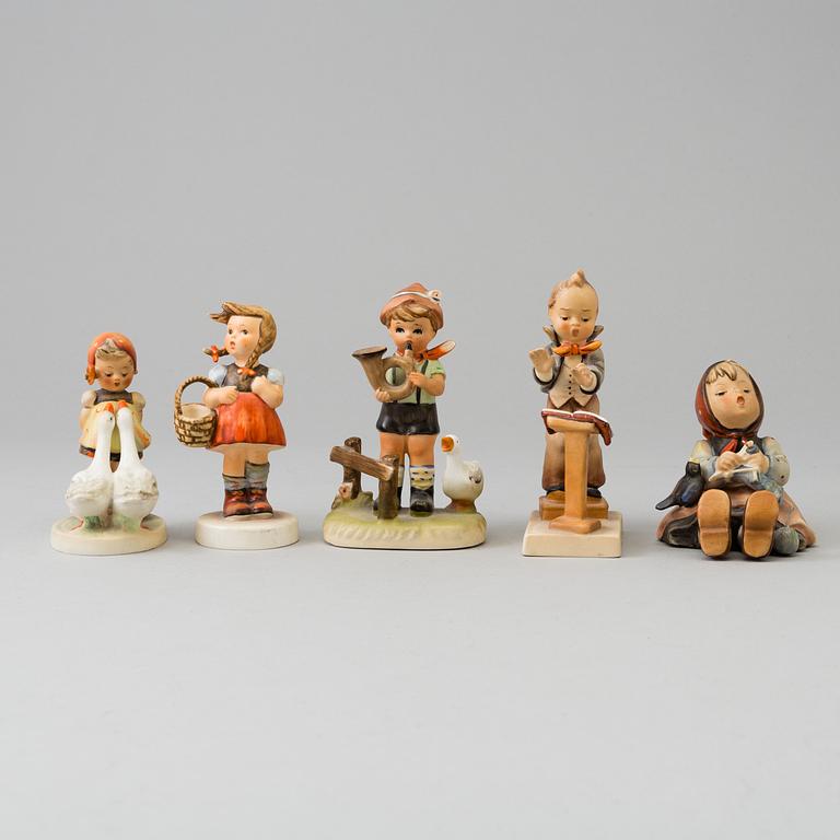 Five porcelain figurines, mostly Goebel.