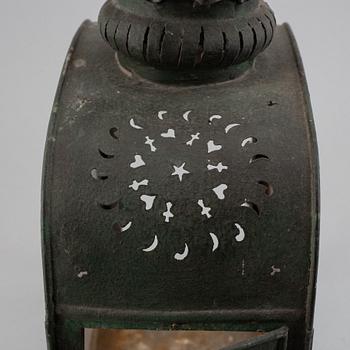 An 18th century tinplate and glass lantern.