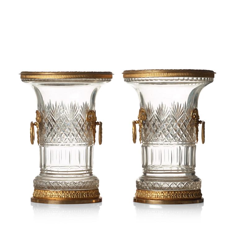 A pair of Empire-style circa 1900 cut glass and gilt-brass urns.