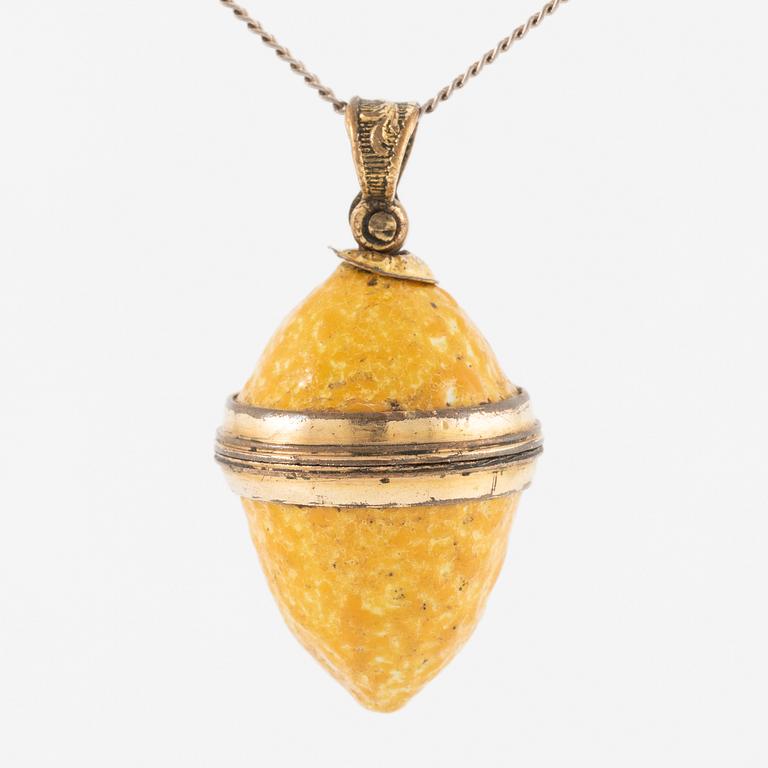 Charm in the form of a lemon with yellow enamel.